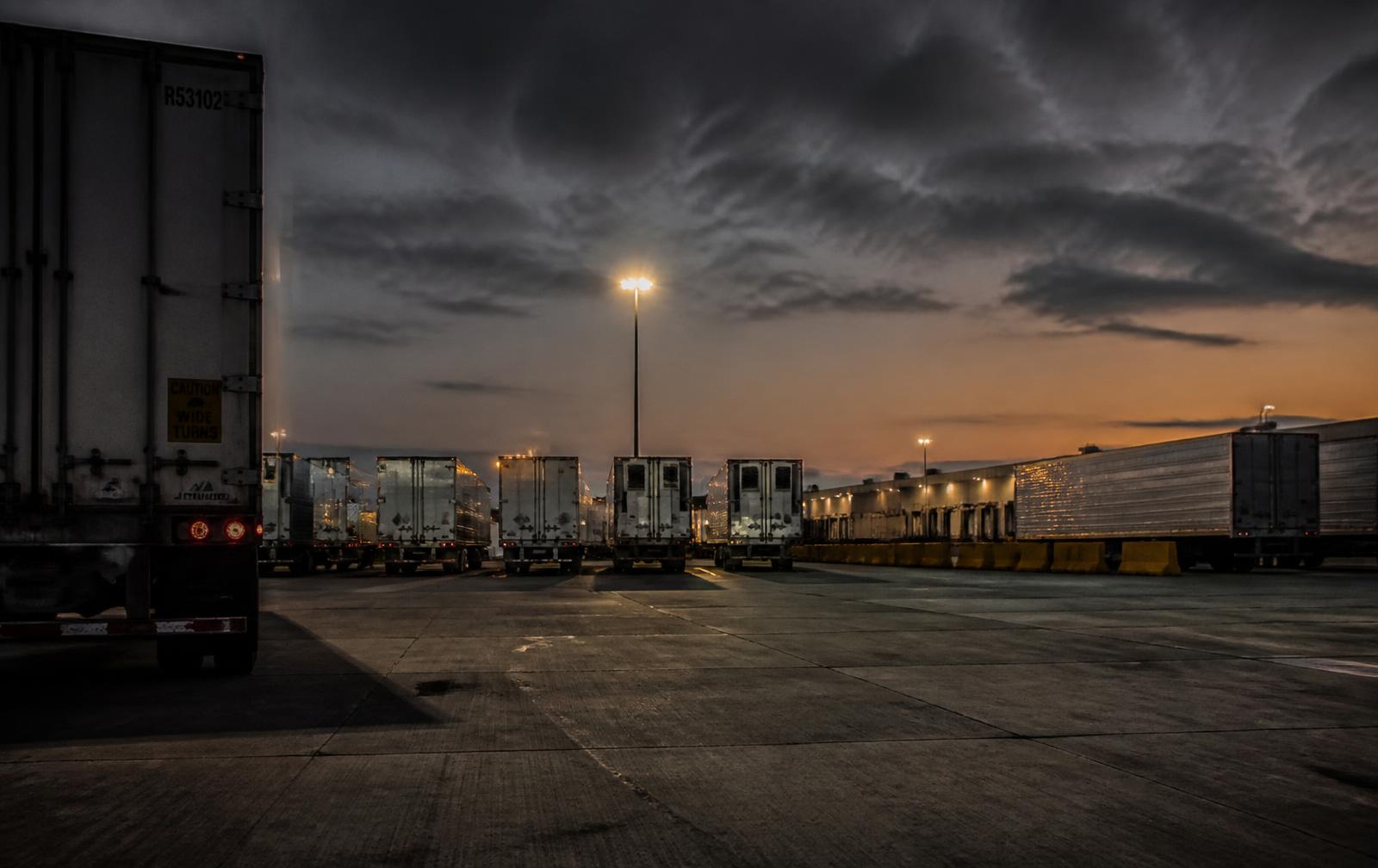 Freight trailers staged at a distribution yard at dusk
